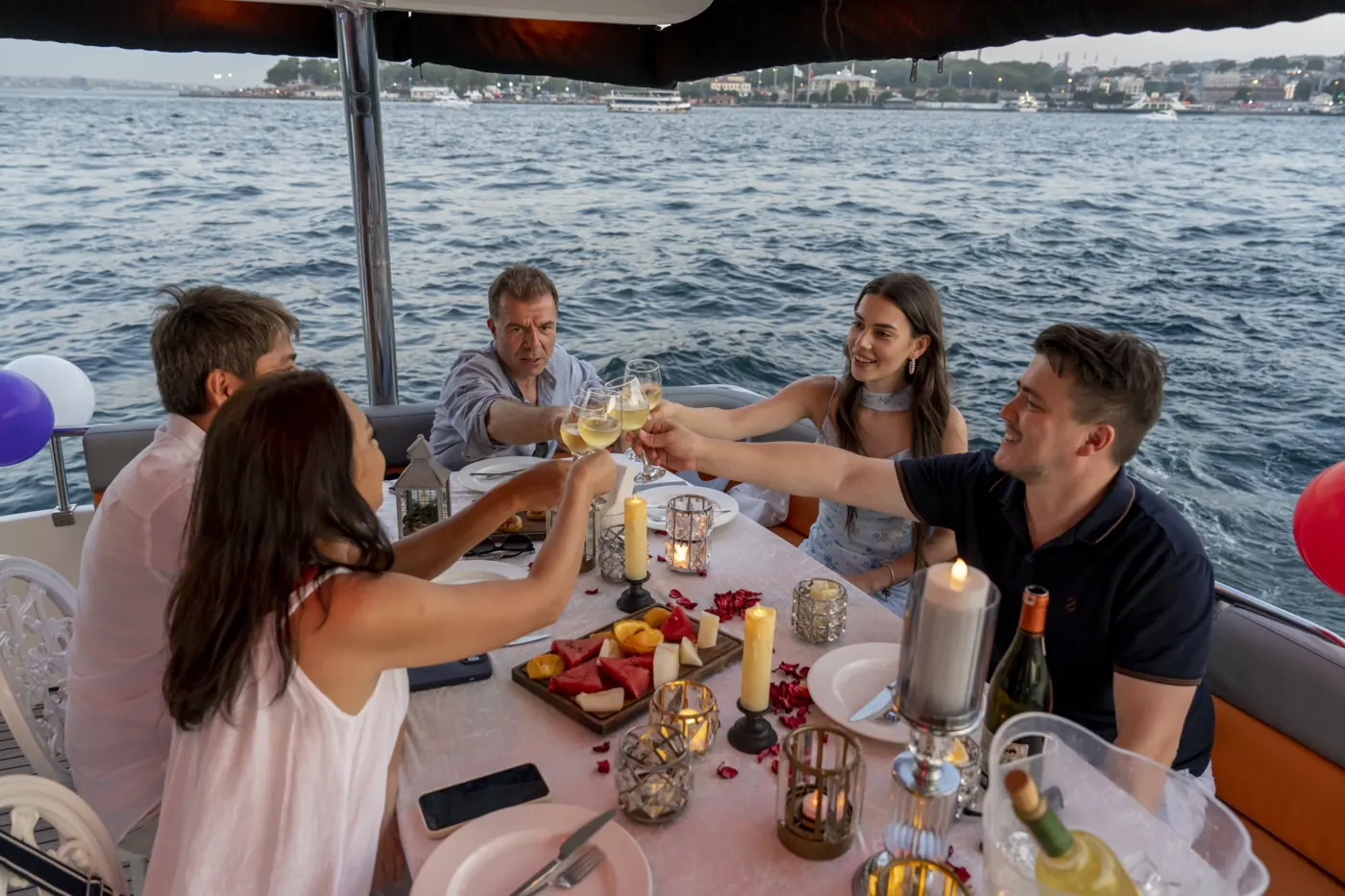 Guests toasting at a yacht celebration