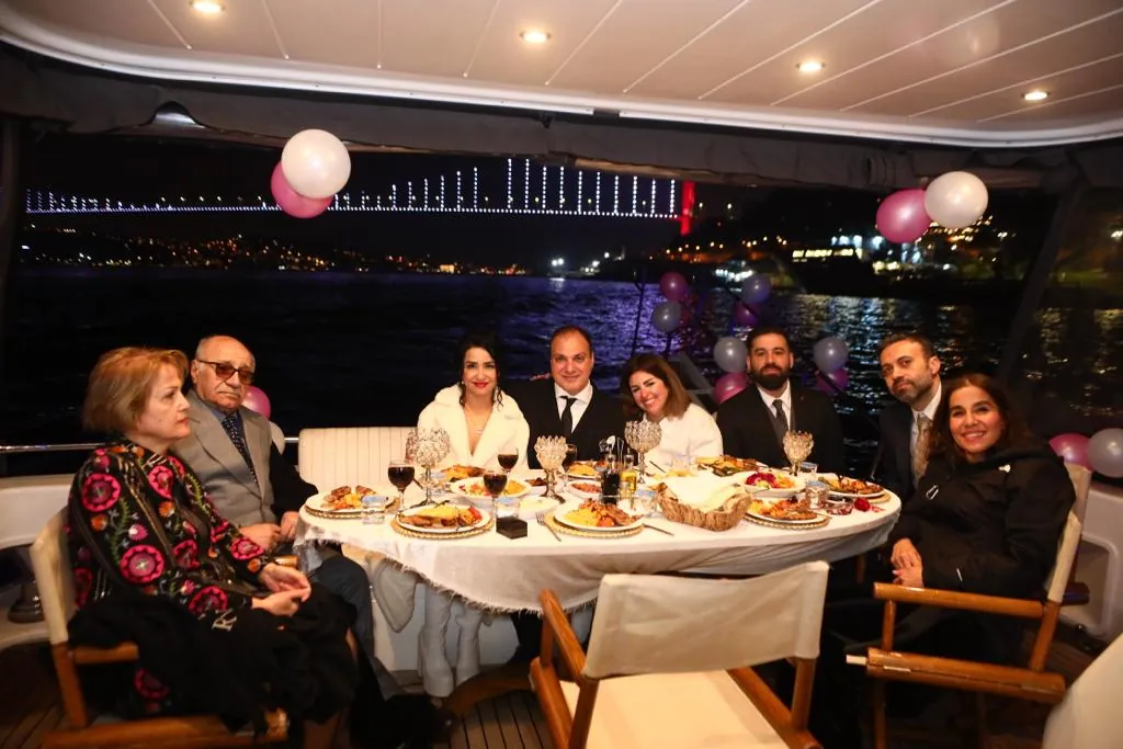 Night party on the yacht with Bosphorus Bridge lights