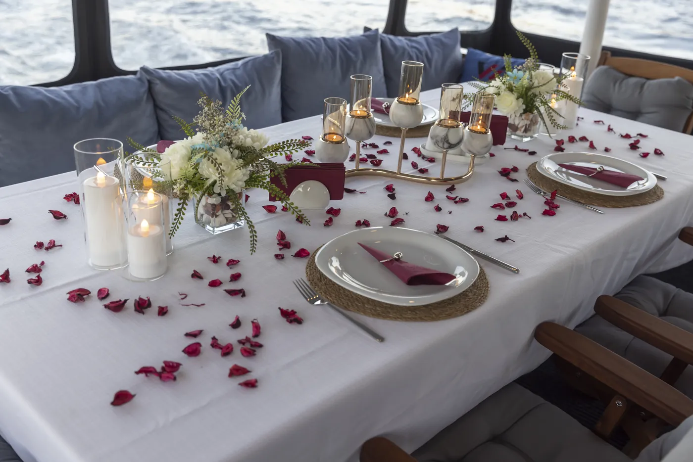 Romantic dinner table set on the yacht